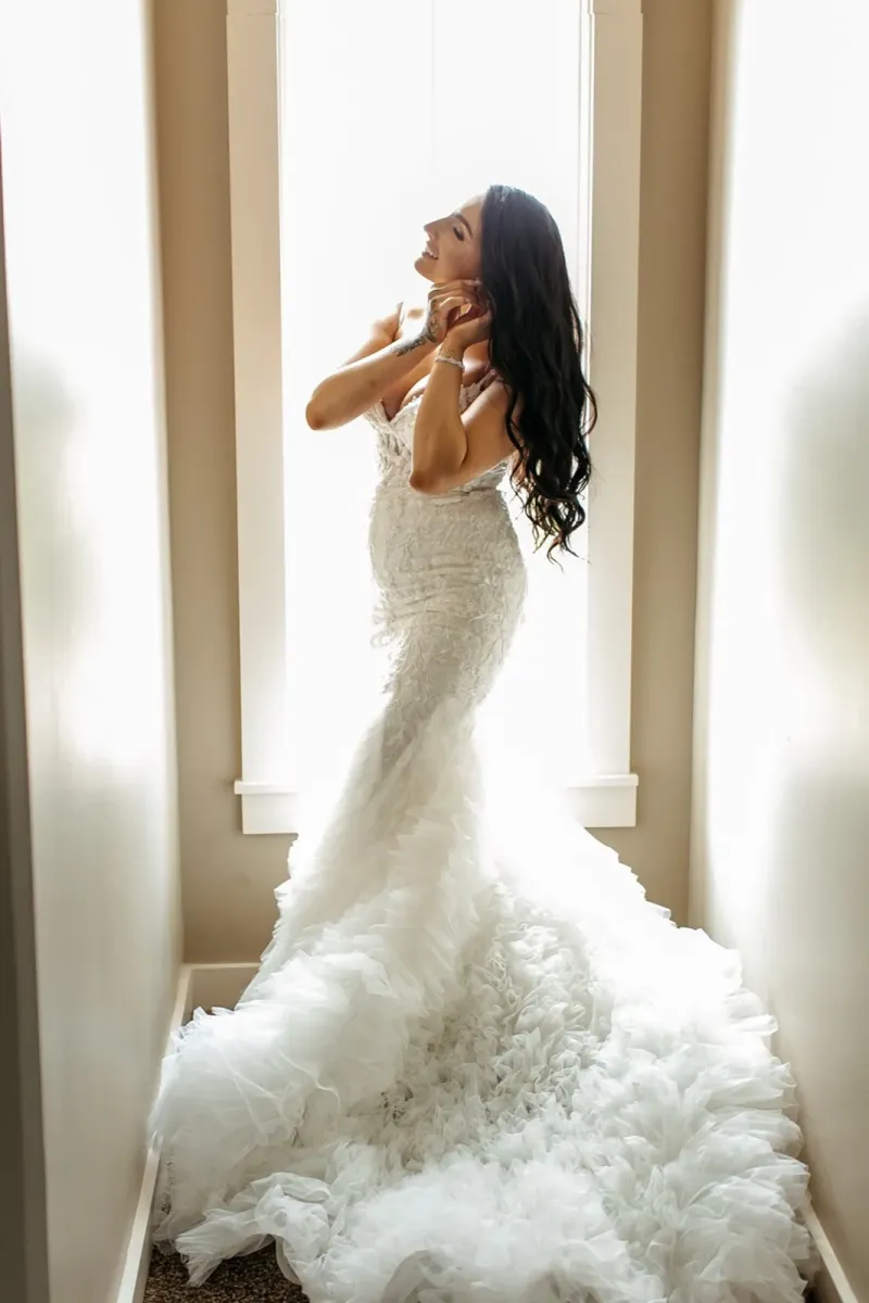 Bride with long dark hair in textured mermaid wedding dress