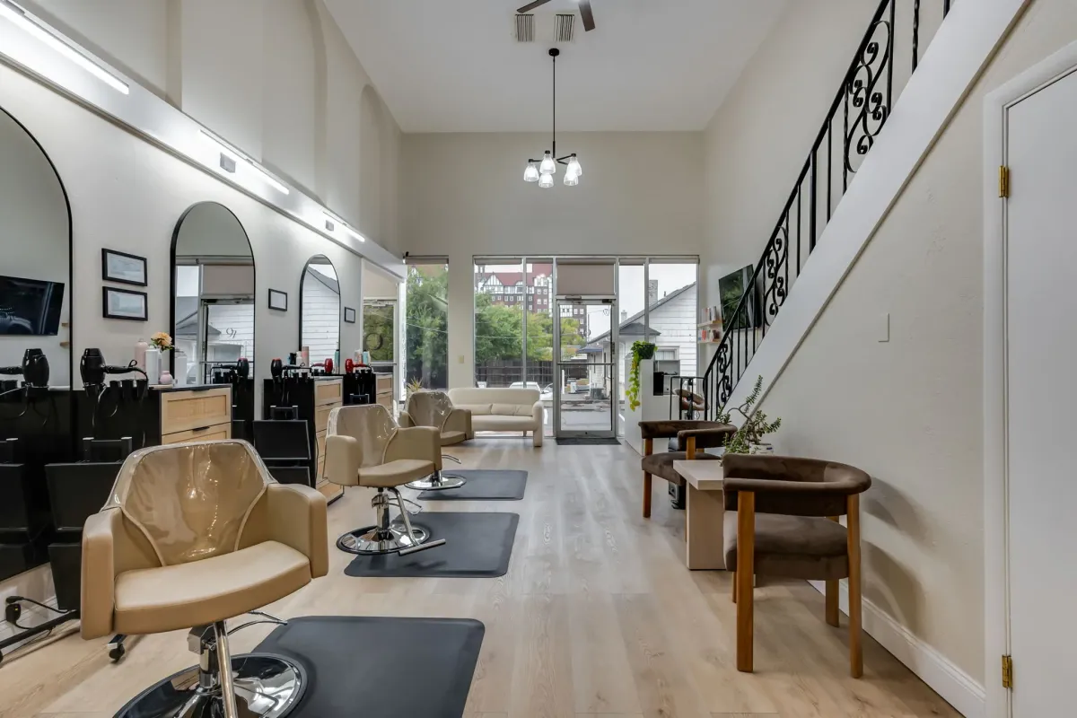 Open concept hair salon with high ceilings and contemporary design